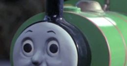 Percy from "Thomas the Tank Engine," featuring his green body and surprised expression, beloved children's character.