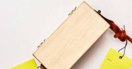 Stylish wooden box with vibrant yellow tags labeled "Aurelia," showcasing unique design inspiration from Mario and Luigi Show.
