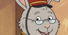 Benny Rabbit, a cheerful character in a red uniform, wearing glasses and a bow tie, smiles warmly in a cozy setting.