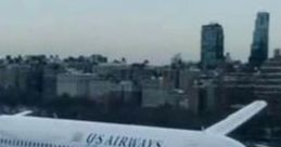 US Airways Airbus A320-200 in flight, showcasing the GPWS system, with a cityscape in the background.
