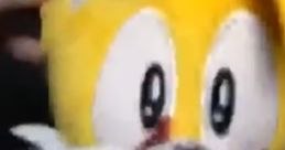 Bloodied plush toy resembling a yellow character, evoking themes of horror and shock, perfect for "Murder On My Mind" aesthetic.