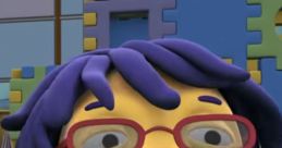 May from "Sid the Science Kid" smiles warmly, wearing glasses and a purple sweater, surrounded by colorful building blocks.