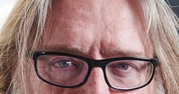 Close-up of a bearded man with glasses, known for contributions to gaming and technology. Gabe HLAGE, industry leader.