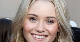 Virginia Gardner smiles brightly at a social event, showcasing her blonde hair and stylish outfit in a casual setting.