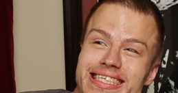 Smiling young man in a "Goonies" shirt, showcasing fun and vibrant energy. Perfect for capturing joyful moments.