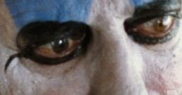 Close-up of Captain Spaulding showcasing dramatic makeup, fierce expression, and menacing gaze typical of horror characters.