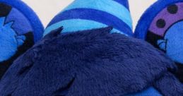 Cheerful blue Teddy Bloxpin plush with glasses and a striped party hat, perfect for fans and collectors.