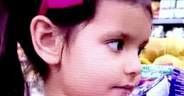 Young girl with pigtails and a bright pink bow, showcasing vibrant colors, ideal for Ellie Toys And Colors (2021) themes.