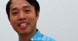 Smiling man in a vibrant Hawaiian shirt with flamingos, showcasing a cheerful and lively personality while promoting Uncle Jay.
