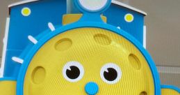 Cheerful yellow train face from Coilbook Max The Glow Train, featuring bright colors and friendly expression. Perfect for kids!