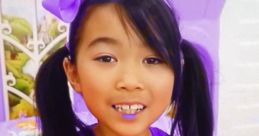 Cheerful child in stylish indigo outfit playing, showcasing Lucy Toys and Colors fashion for kids, season 8-11.