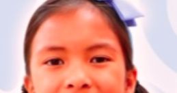 Smiling girl with pigtails and a blue bow, showcasing the fun and creativity of Wendy Toys And Colors.