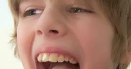 Joyful boy laughing and shouting with excitement, showcasing a bright smile and playful energy. Perfect for family moments.