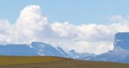 Back Porch In Montana: Enjoy A Windy Afternoon In The Backyard Rocking Chair Of Your Montana Cabin. The ambient cape titled