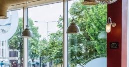 A Nice Day In A Cafe "A Nice Day In A Cafe" captures the inviting atmosphere of a quaint cafe, where the aroma of freshly