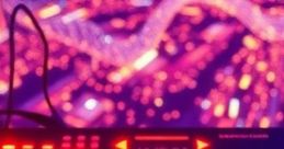 Colorful synthesizer keyboard with bright red lights, creating a vibrant atmosphere ideal for music production.