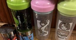 Colorful GG energy drink containers, shakers, and stickers, featuring the Gwps Pull Up Woop Woop theme for gamers.