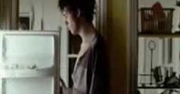 Person contemplating drink choices at a fridge, highlighting the "Know Your Limits" alcohol awareness campaign.