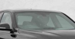 Sleek black BMW with stylish alloy wheels, showcasing luxury design and performance in automotive advertising.