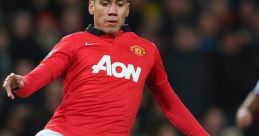 Player in red jersey skillfully dribbles the ball during a match, showcasing excitement of England United football club culture.