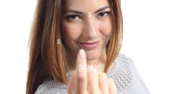 Woman invitingly gestures with her hand, exuding confidence and charm, embodying the phrase 'come here.