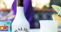 Malibu Rum bottle with a tropical cocktail and pineapple juice, perfect for summer refreshment and festive gatherings.