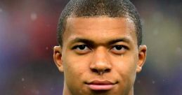 Kylian Mbappé in a blue France jersey, focused and determined, showcasing his iconic presence on the football field.