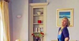 Woman in a blue dress joyfully vacuums carpet with Shake N Vac, bright living room backdrop enhancing the cheerful atmosphere.
