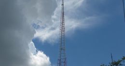 Towering radio transmission tower against a blue sky, essential for broadcasting Nuke Radio signals and communication.