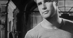 Marlon Brando in a classic scene from "A Streetcar Named Desire," showcasing his iconic performance and charisma.