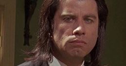 Vincent Vega, a stylish hitman, portrays intensity in a black suit, capturing a pivotal moment in a classic film.