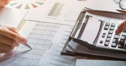 Hands analyzing financial charts and reports with a calculator, reflecting business planning and data analysis in a workspace.