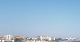 Scenic view of Florida's waterfront, showcasing marinas, calm waters, and clear blue skies on a sunny day.
