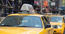 Yellow taxi cab driving through a city street, showcasing urban transportation and iconic taxi services in New York.