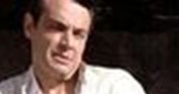 Alejandro Sosa from Scarface, seated with a cup, exuding a tense vibe amidst opulent surroundings.