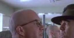 Gunnery Sgt. Hartman confronts a recruit in intense training scene from Full Metal Jacket, showcasing military discipline.