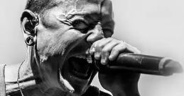 Chester Bennington passionately performing on stage, embodying the raw energy of Linkin Park's music.