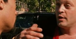 Two men engage in a heated conversation, showcasing a pivotal moment in the film "Be Cool" (2005).