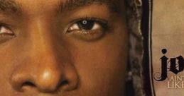 Close-up of Joe, the R&B singer, showcasing intense gaze and distinct hairstyle, embodying his unique musical style.