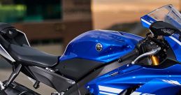 Detail of a blue Yamaha R6 motorcycle highlighting its sleek design and powerful engine components. Perfect for racing enthusiasts.