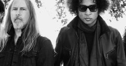 Alice in Chains band members posing in black and white, showcasing their distinctive rock style and iconic presence.