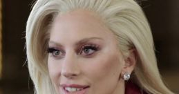 Lady Gaga in a stylish red leather jacket, showcasing her signature glamorous look during an engaging discussion.