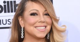 Mariah Carey smiles at the Billboard Music Awards, showcasing her glamorous style and signature blonde waves.
