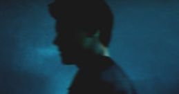 Silhouette of a musician against a blue background, evoking themes of freedom and empowerment from "There's Nothing Holdin' Me Back.
