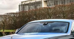 Luxury Rolls-Royce Wraith showcasing elegant design with a striking blue and black color combination, parked outdoors.