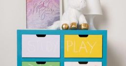 Colorful storage drawers with chalkboard labels for "Study," "Play," "Toys," and "Bath," adding fun and function to any room.