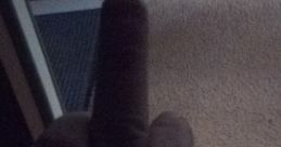 A hand showing a disruptive gesture, conveying strong emotions related to frustration or defiance.