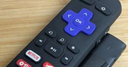 Roku remote control beside a streaming stick, showcasing essential buttons for easy access to popular streaming services.