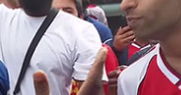 Fans interacting passionately outside the stadium, showcasing excitement for Claude Arsenal and team spirit.