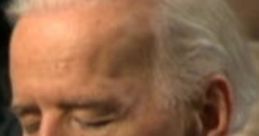 Joe Biden listening intently during a Board meeting, showcasing his focus and engagement in important discussions.